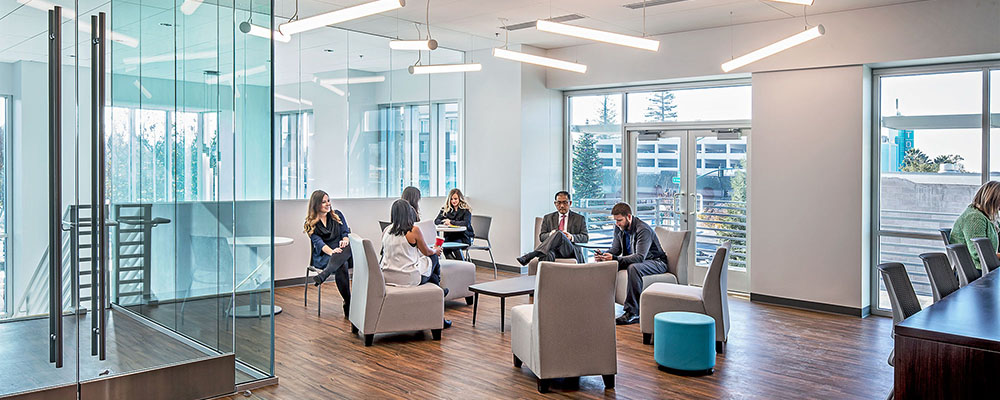 Photo of an open plan office with employees sitting